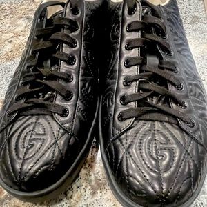 GUCCI - Black Leather Quilted Monogram Tennis Shoes. These are a Gucci Size 12